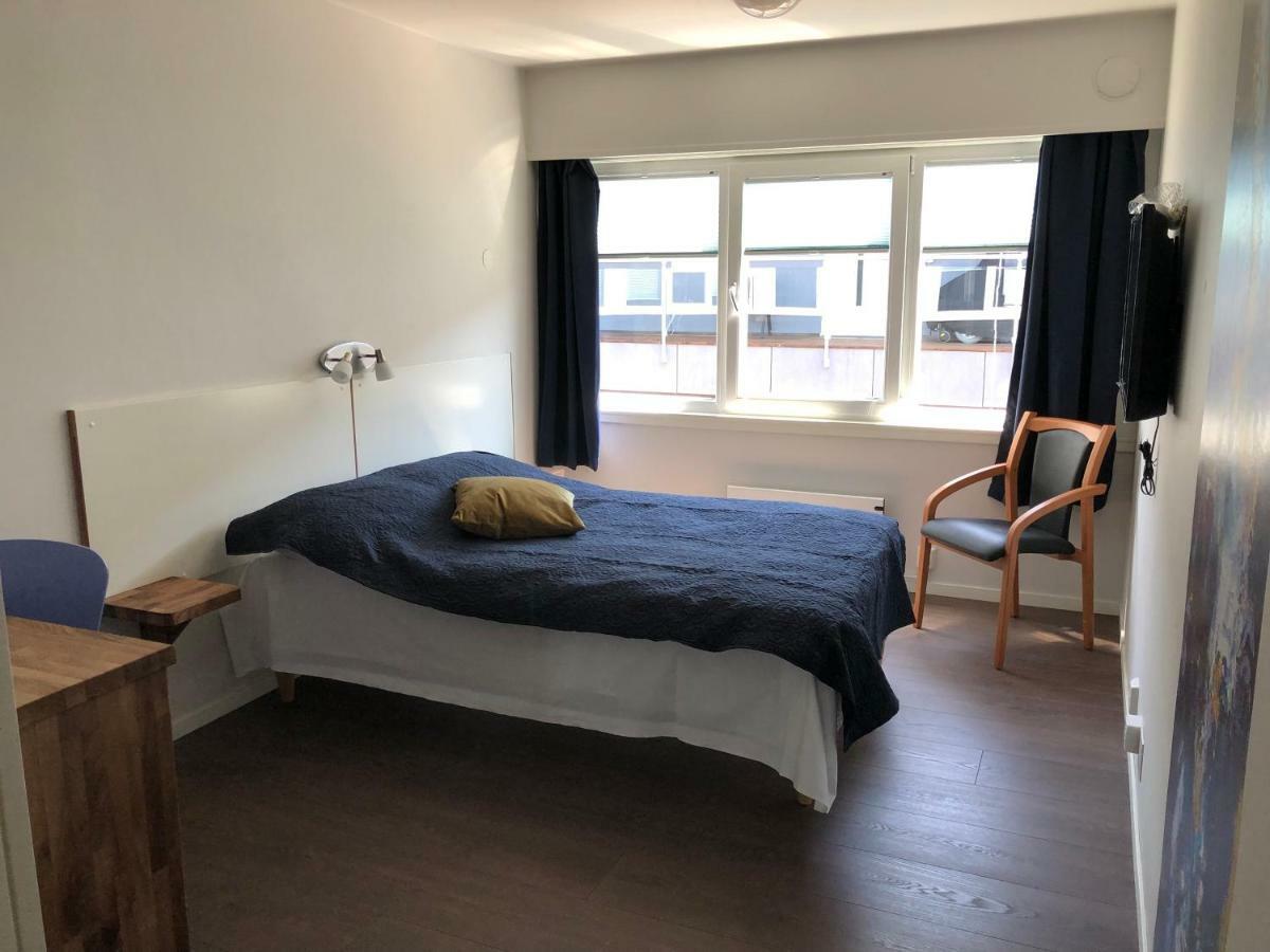 Husnes Sentrum Hotell Bagian luar foto