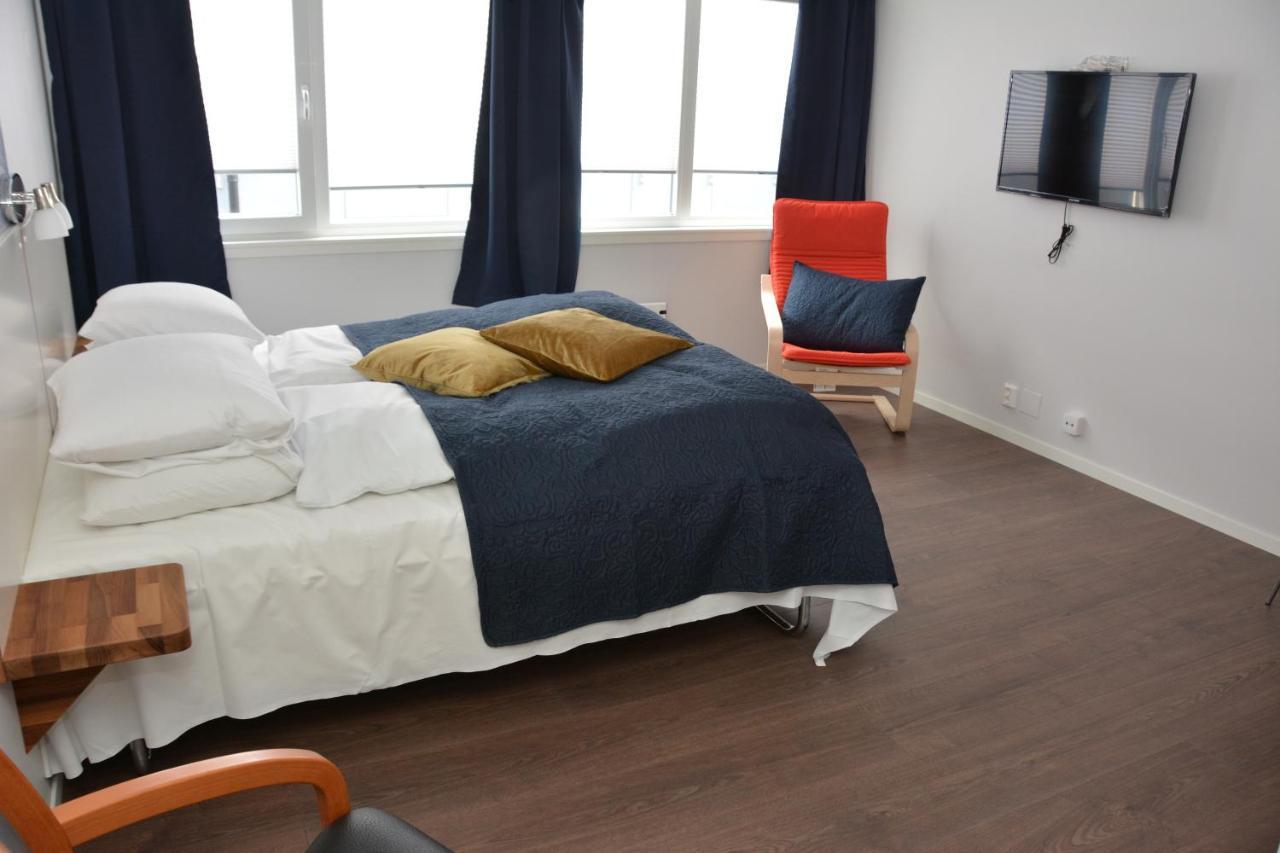 Husnes Sentrum Hotell Bagian luar foto